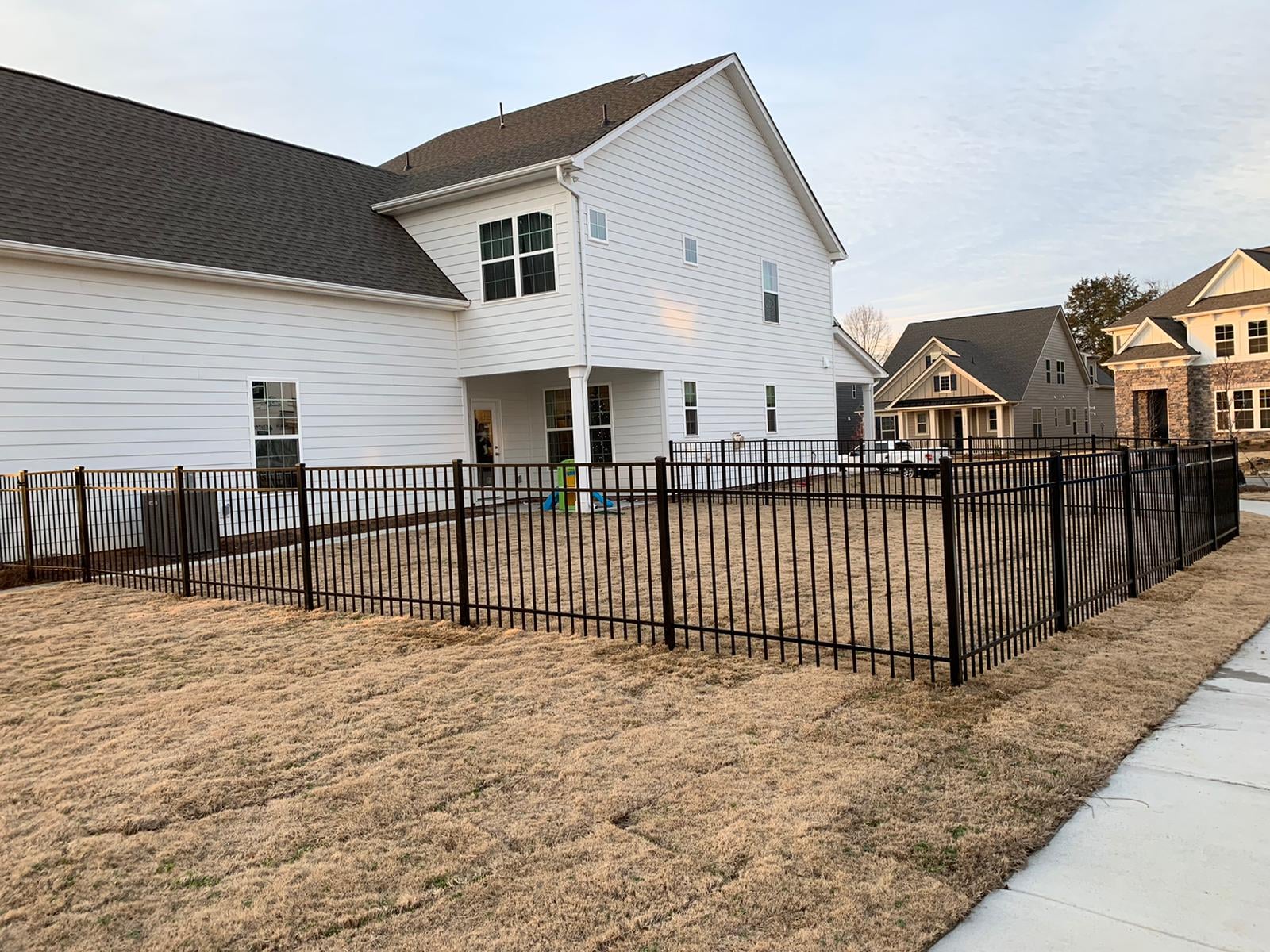 Black aluminum fence on a backyard in Charlotte, NC